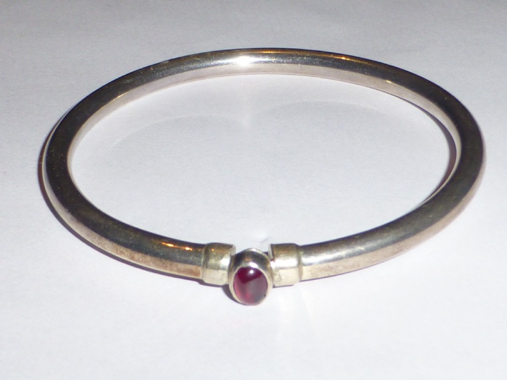 Silver and oval cabochon ruby  bangle
