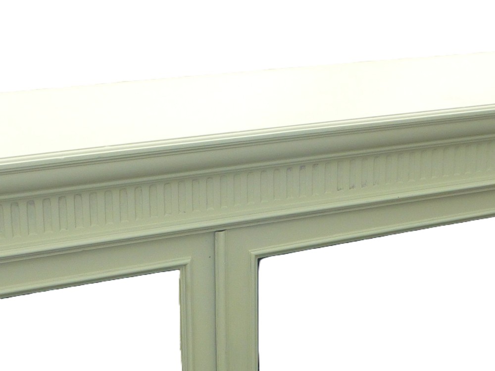 A 19th-century off-white painted bookcase featuring three glazed glass doors, fluted side pilasters, and a contrasting dark interior. View III