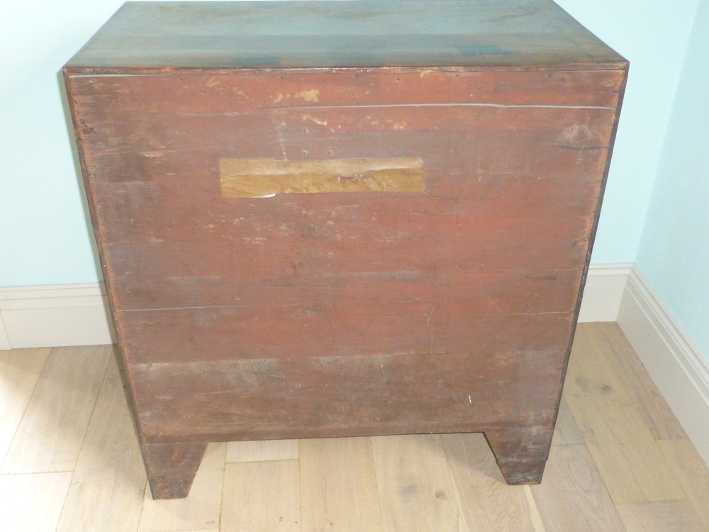 A late eighteenth-century Georgian mahogany chest of drawers with two short drawers over three long graduated drawers, featuring line inlay and oval brass handles. View VI