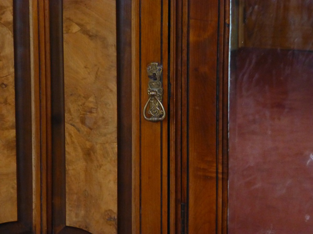 A mid-19th-century Victorian triple wardrobe made of rich burr walnut, featuring a central full-length mirror door flanked by two carved panelled doors. View IV