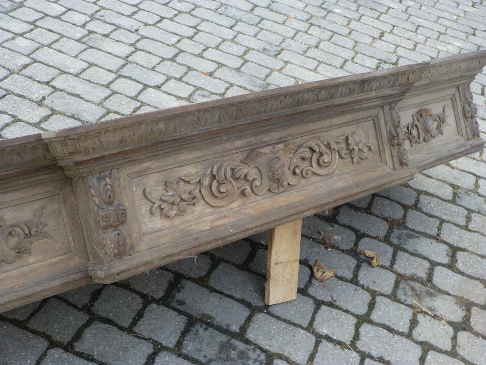 A large 19th-century French carved oak bed canopy featuring intricate foliate scrollwork and mouldings. View II