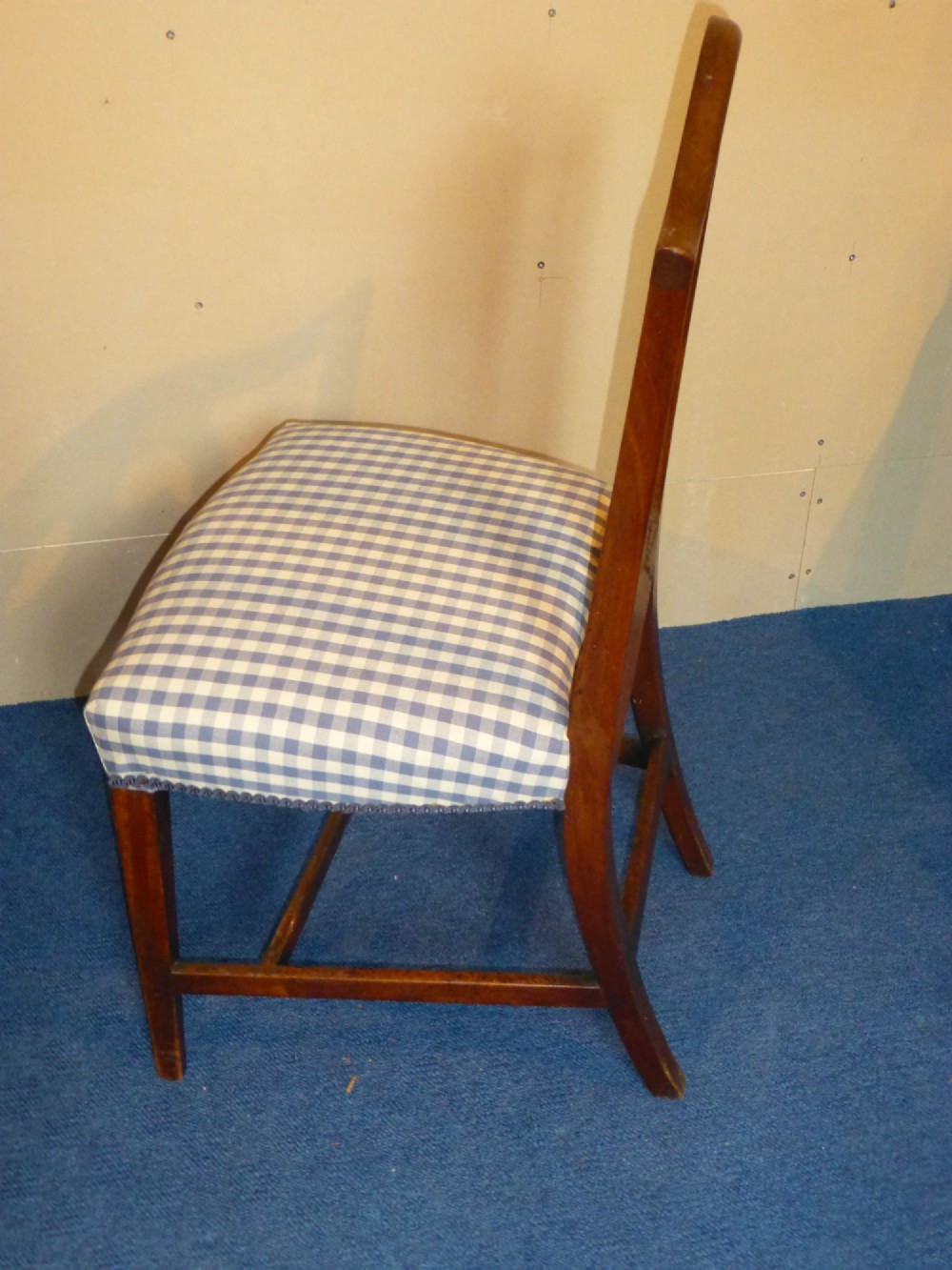 An 18th-century Georgian Chippendale side chair featuring a carved pierced splat back, warm fruitwood frame, and a blue and white checked upholstered seat. View IV