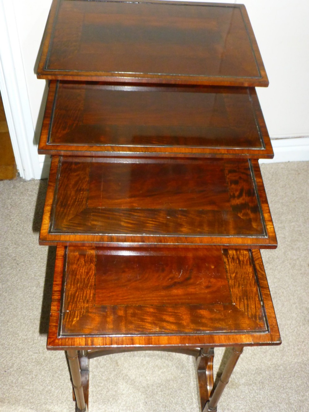 Edwards and Roberts inlaid set of four tables quartetto. C1895.