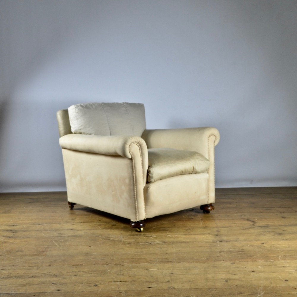 DEEP SEATED ENGLISH ARMCHAIR - REUPHOLSTERY INC.