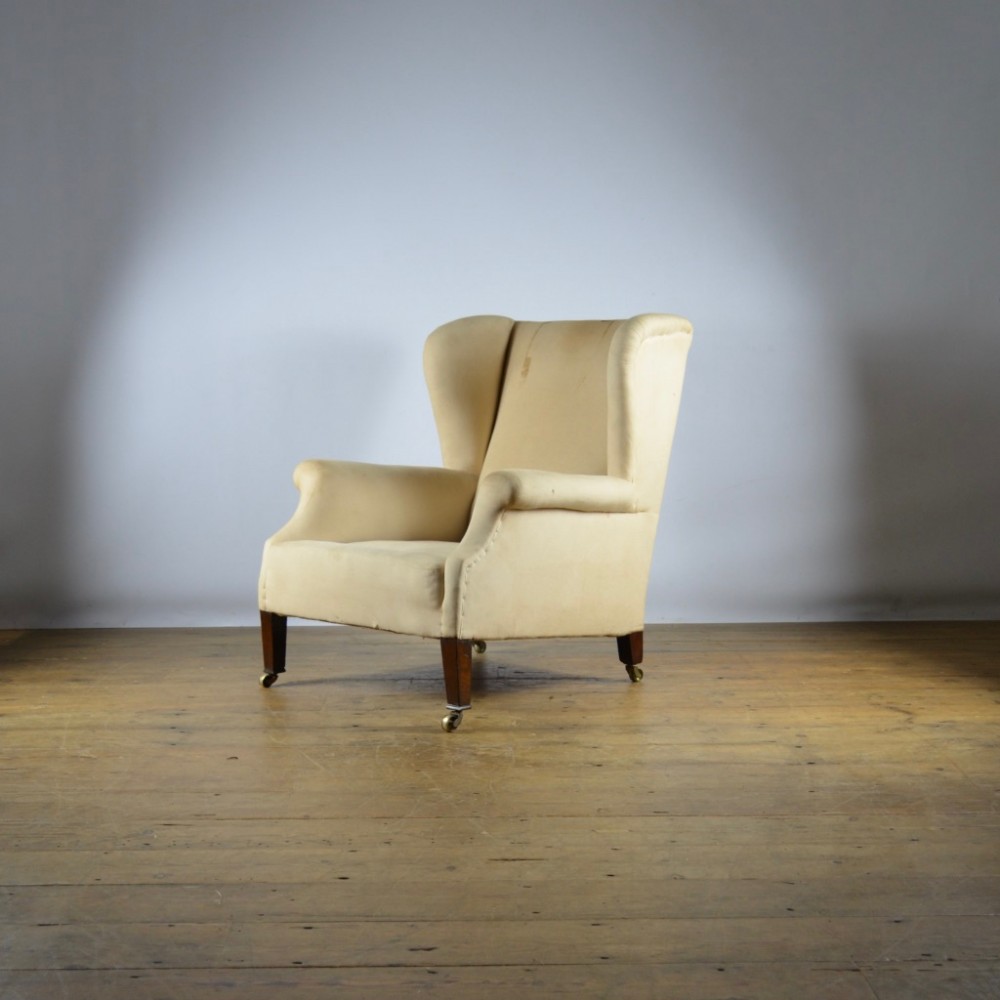 SMALL ENGLISH WINGED ARMCHAIR - REUPHOLSTERY INC.