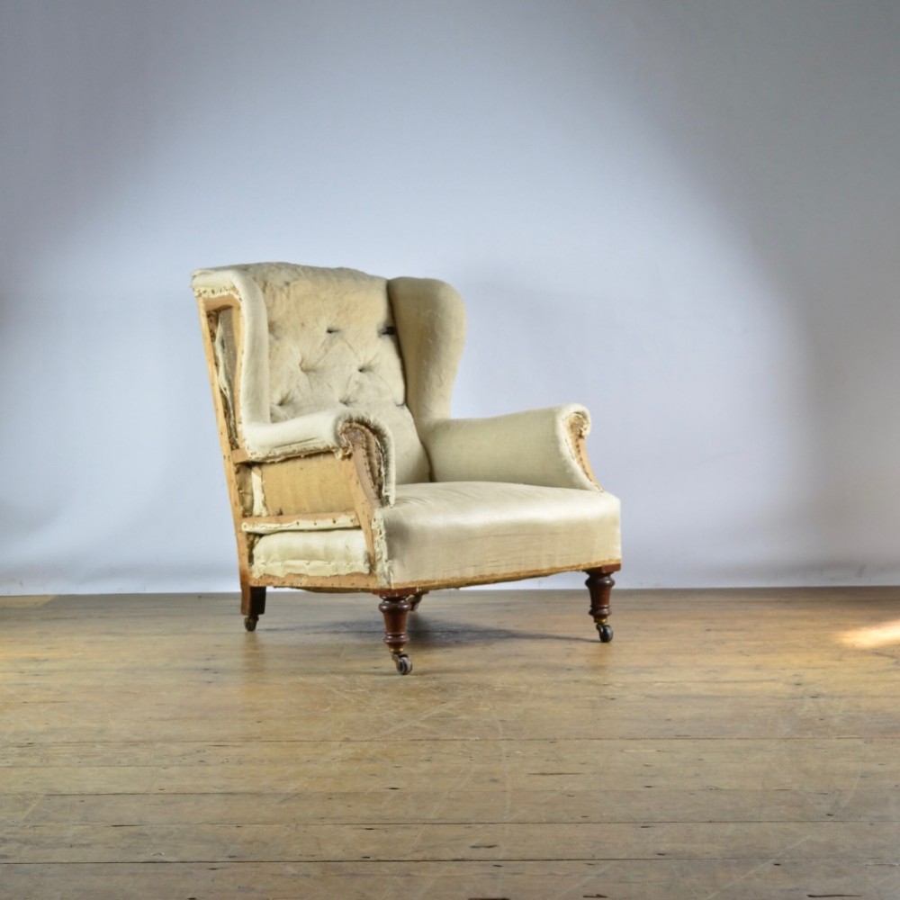 19TH CENTURY ENGLISH WINGED ARMCHAIR - FULL REUPOL. INC.