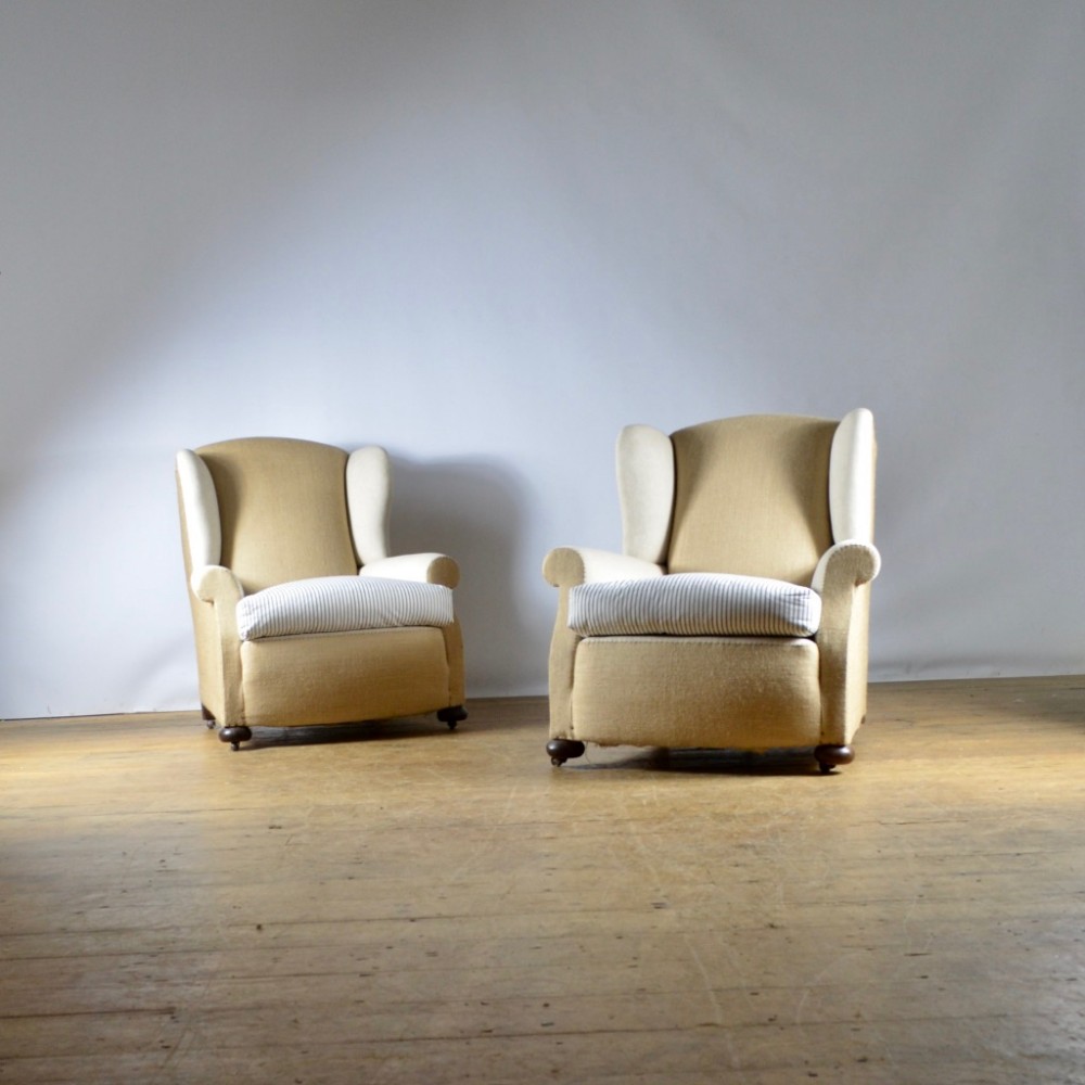 PAIR OF WINGED ARMCHAIRS - FULL REUPHOLSTERY INC.