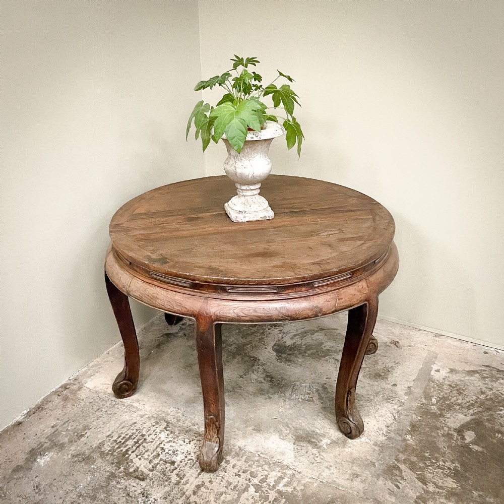A pair of warm brown semicircular wooden console tables with carved aprons and outward-curved cabriole legs. View II