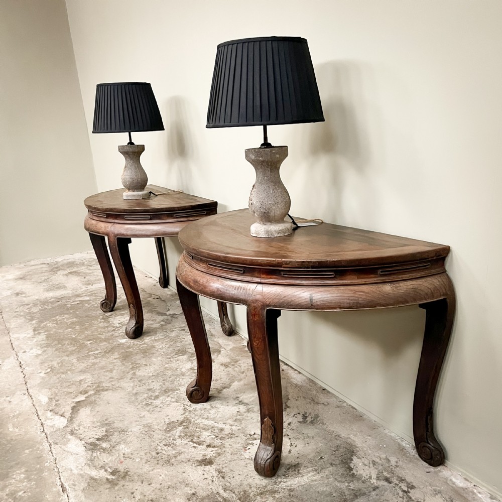 A pair of warm brown semicircular wooden console tables with carved aprons and outward-curved cabriole legs. View III