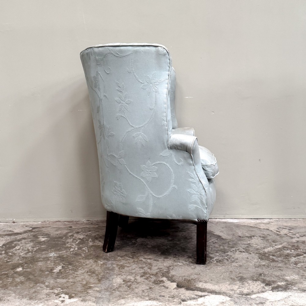 A light blue 1920s ribbed barrel back armchair with floral fabric upholstery and square dark wood legs. View III