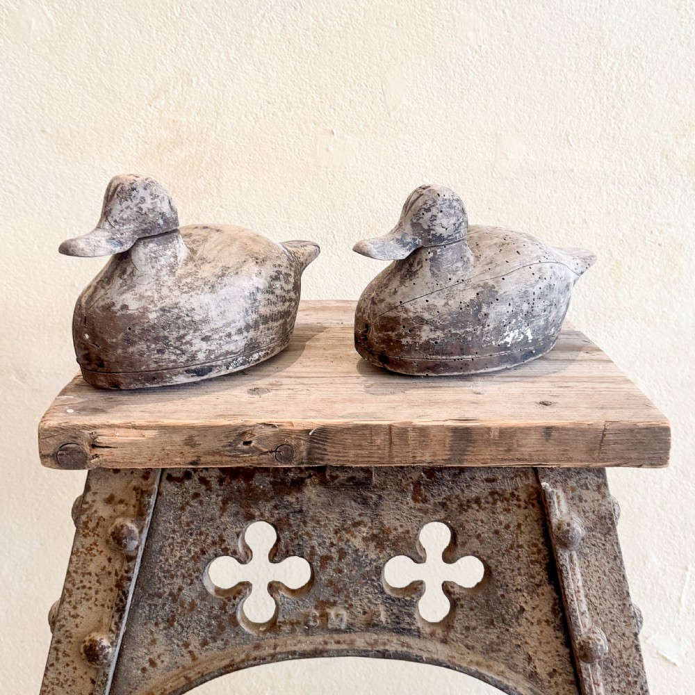 An industrial cast iron stand featuring trefoil arch cut-outs, a riveted frame, and a rectangular wooden top. View IV