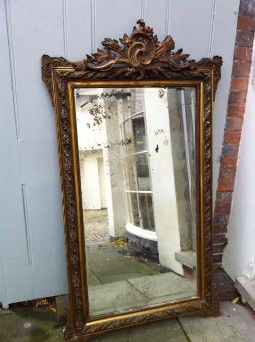Early 19th Century French Gilt Ornate Carved Wood and Gesso Wall Mirror