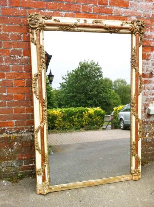 Large Highly Decorative Early 19th Century French Cream Gilt and Red Carved Wood Mirror.