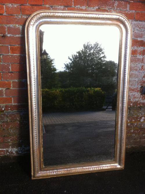 A Highly Useful Large Early 19th Century French Arched Top Silvered and Cream Mirror