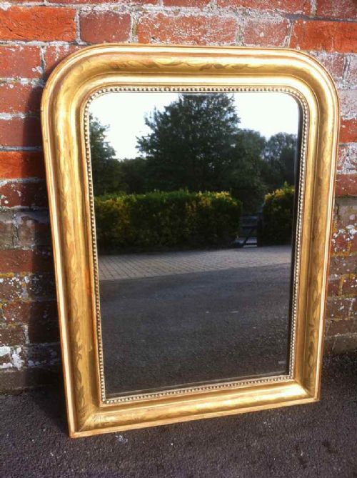 A Good Size 19th Century French Arched Top Gilt Mirror.