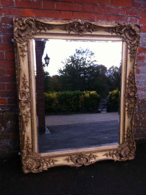 A Stunning Large 19th Century English Carved Wood Cream and Gilt Mirror.