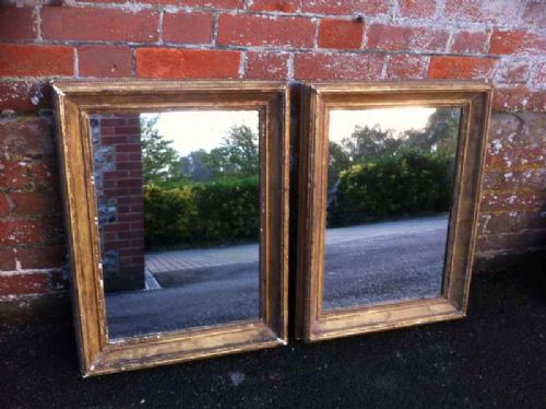 A Pair of Useful 19th Century English Carved Wood and Gilt Mirrors.
