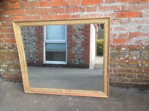 A Good Size Early Antqiue 19th Century French Carved Wood and Gilt Mirror.