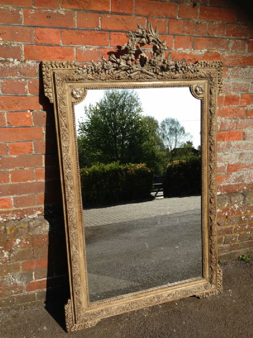 A Large Highly Decorative Antique 19th Century French Carved Wood and Gesso Painted Mirror.