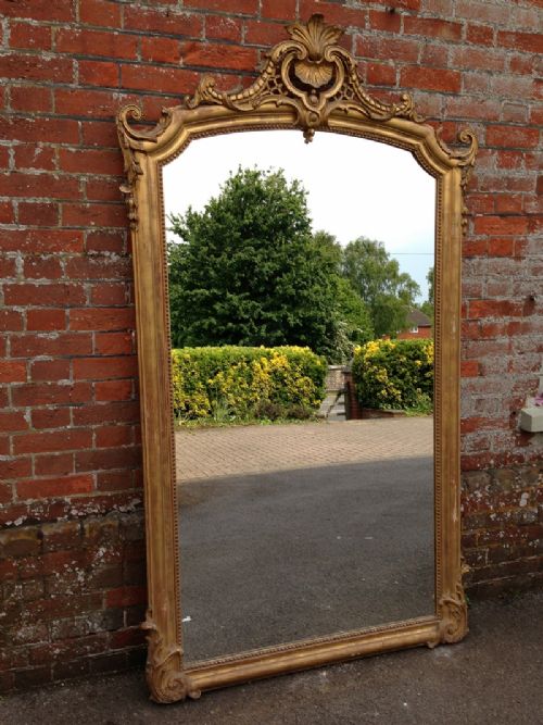 A Fabulous Large Early Antique 19th Century French Carved Wood and Gesso Gilt Mirror.