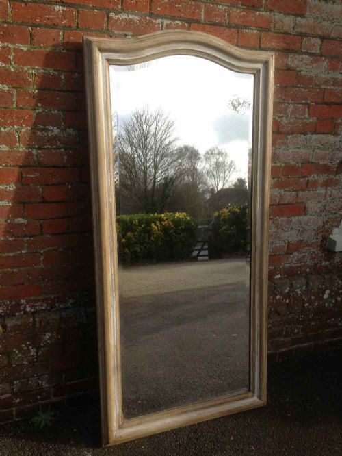 A Large Antique 19th Century French Carved Wood and Gesso Shaped Top Plain Painted Mirror.