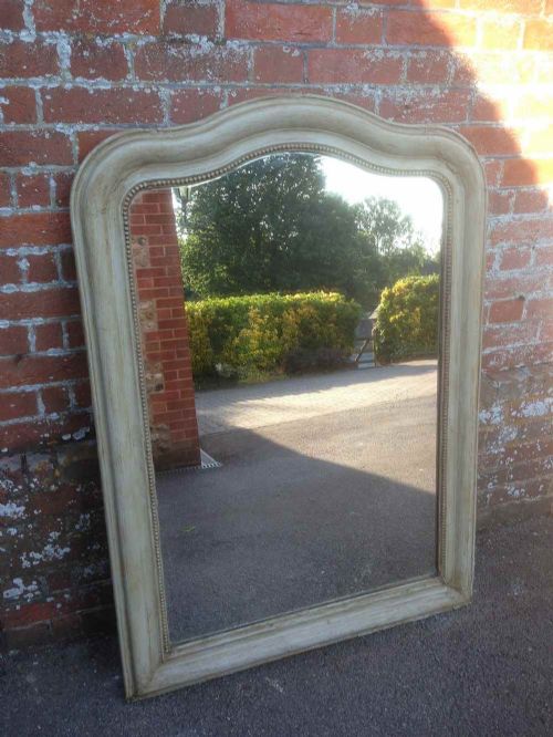 An Antique 19th Century French Carved Wood and Gesso Painted Shaped Top Mirror.