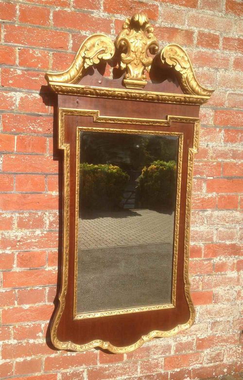 A Good Size Antique 19th Century English Carved Maghogony & Gilt Shaped Top Mirror.