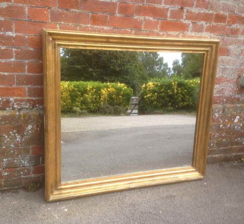 A Good Size Antique 19th Century French Carved Wood Distressed Original Gilt Bistro Mirror.