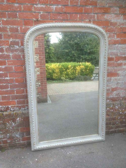 A Large 19th Century French Carved Wood and Gesso Painted Arched Top Mirror.
