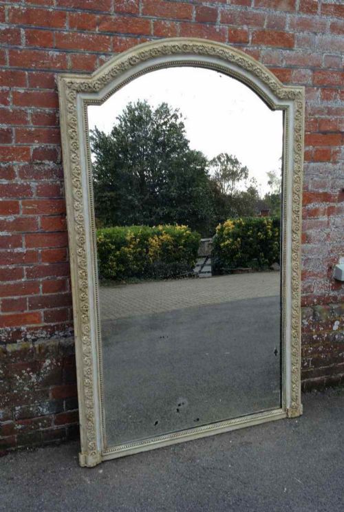A Stunning Large Antique 19th Century French Carved Wood and Gesso Shaped Top Distressed Cream Painted Mirror.