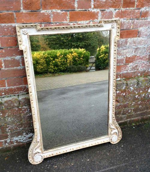 An Unusual Shaped Antique 19th Century French Carved Wood and Gesso Painted Mirror.