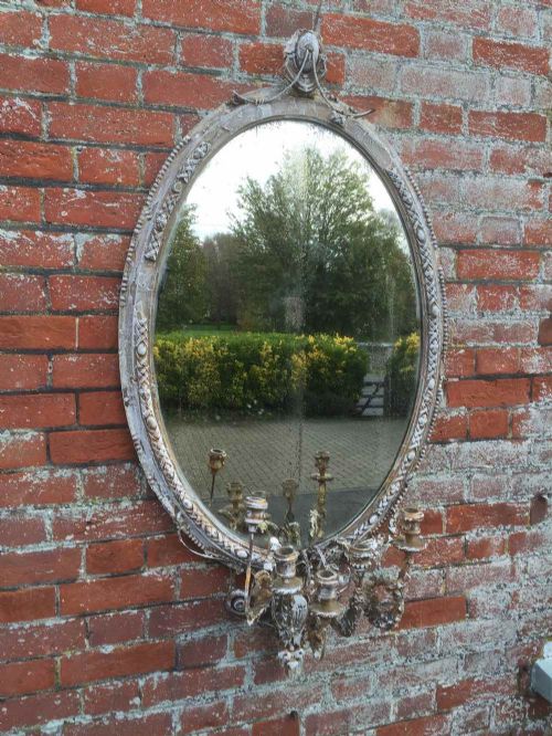 A Highly Distressed Original Early 19th Century French Carved Wood and Gesso Gilt & Painted Oval Mirror.