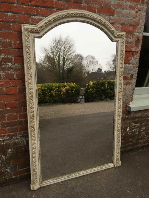 A Large Shaped Top Antique 19th Century French Carved Wood and Gesso Painted Mirror.