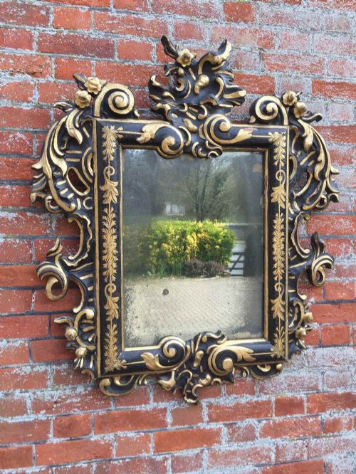 A Stunning Early 19th Century Spanish Ebonised and Gilt Carved Wood Mirror.