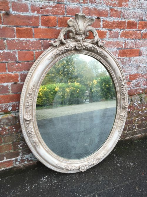 A Fabulous Antique 19th Century French Carved Wood and Gesso Painted Oval Mirror.