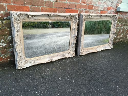 A Highly Decorative Pair of Antique 19th Century English Carved Wood Painted Distressed Mirrors.