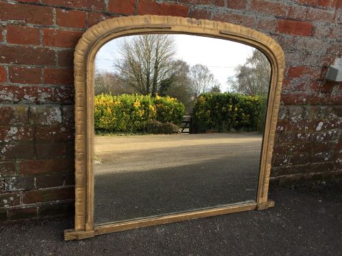A Highly Useful Size Antique 19th Century English Carved Wood Original Gilt Distressed Arched Overmantel Mirror.
