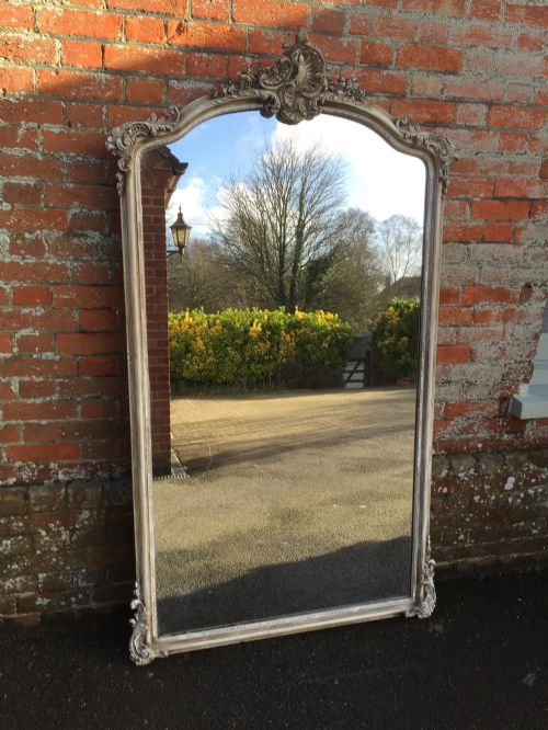 An 19th Stunning Large Antique 19th Century French Carved Wood & Gesso Shaped Top Painted Mirror.