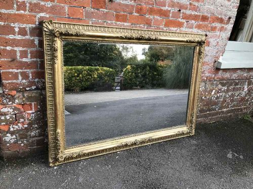 A Spectacular Very Useful Size Antique Early 19th Century French Carved Wood and Gesso Original Gilt Mirror.