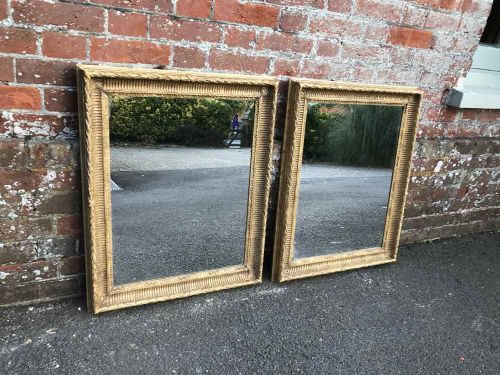 A Very Useful Pair of Early 20th Century English Carved Wood Original Gilt Ribbed Framed Mirrors.