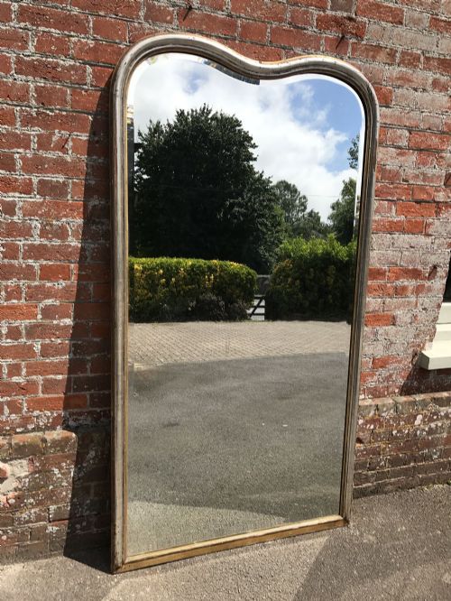 A Spectacular Large Antique 19th Century French Carved Wood and Gesso Slightly Distressed Original Silver/ Gilt Shaped Top Mirror.