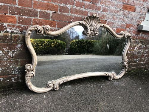 A Highly Unusual Good Size Early 20th Century French Carved Wood Painted Shaped Mirror.