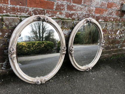 A Fabulous Pair of Antique 19th Century French Carved Wood and Gesso Oval Painted Mirrors.