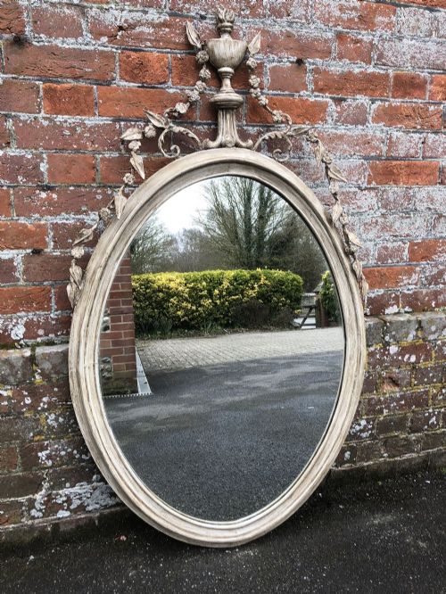 An Exquisite Large 19th Century English Carved Wood and Gesso Painted Sheraton Oval Mirror.
