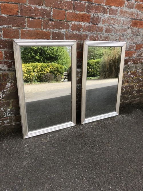 A Superb Pair of Antique 19th Century French Carved Wood and Gesso Original Silvered Ribbed Bistro Mirrors with Original Mercury Mirror.