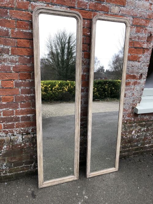 A Superb Pair of Antique French 19th Century Carved Wood Arched Top Painted Pier Mirrors.