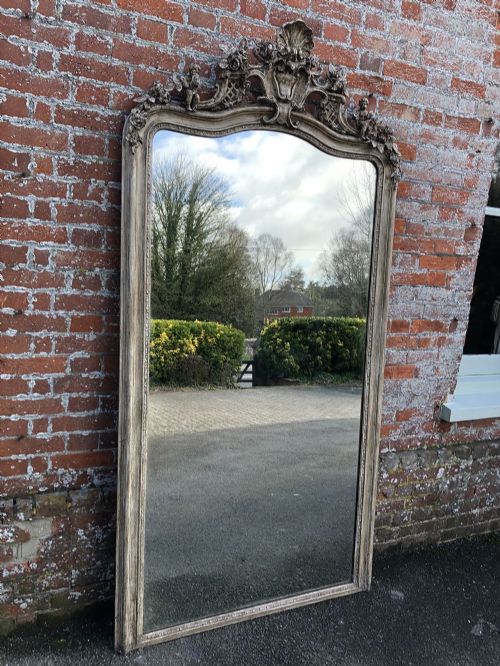 A Superb Large Antique 9th Century French Carved Wood and Gesso Shaped Top Mirror.