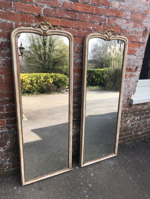 A Spectacular Pair of Antique French 19th Century Carved Wood & Gesso Shaped Top Orignal Gilt and Painted Pier Mirrors.