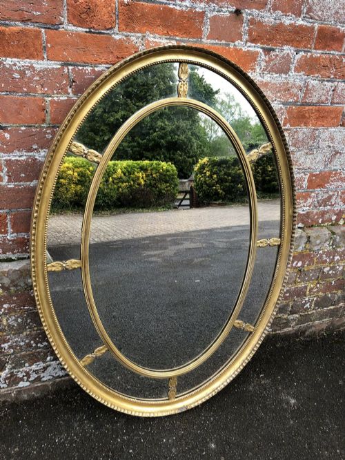 A Fabulous Good Size Antique 19th Century English Carved Wood Orignal Gilt Oval Sectioned Mirror.