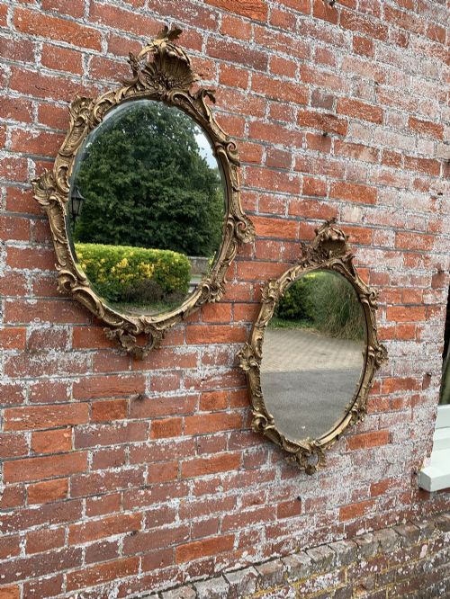 A Delightful Pair of Antique French 19th Century Carved Wood & Gesso Original Gilt Ornate Slightly Distressed Oval Mirrors.